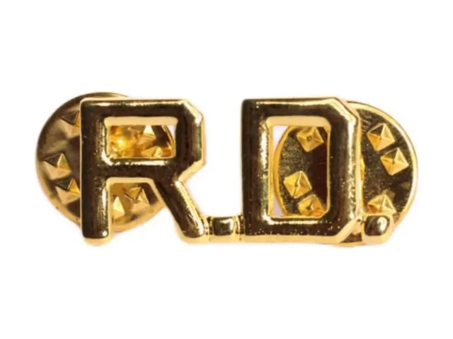 Insignia de metal R.D.